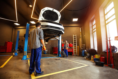 two-specialists-uniform-repairing-car-together-garage.jpg  